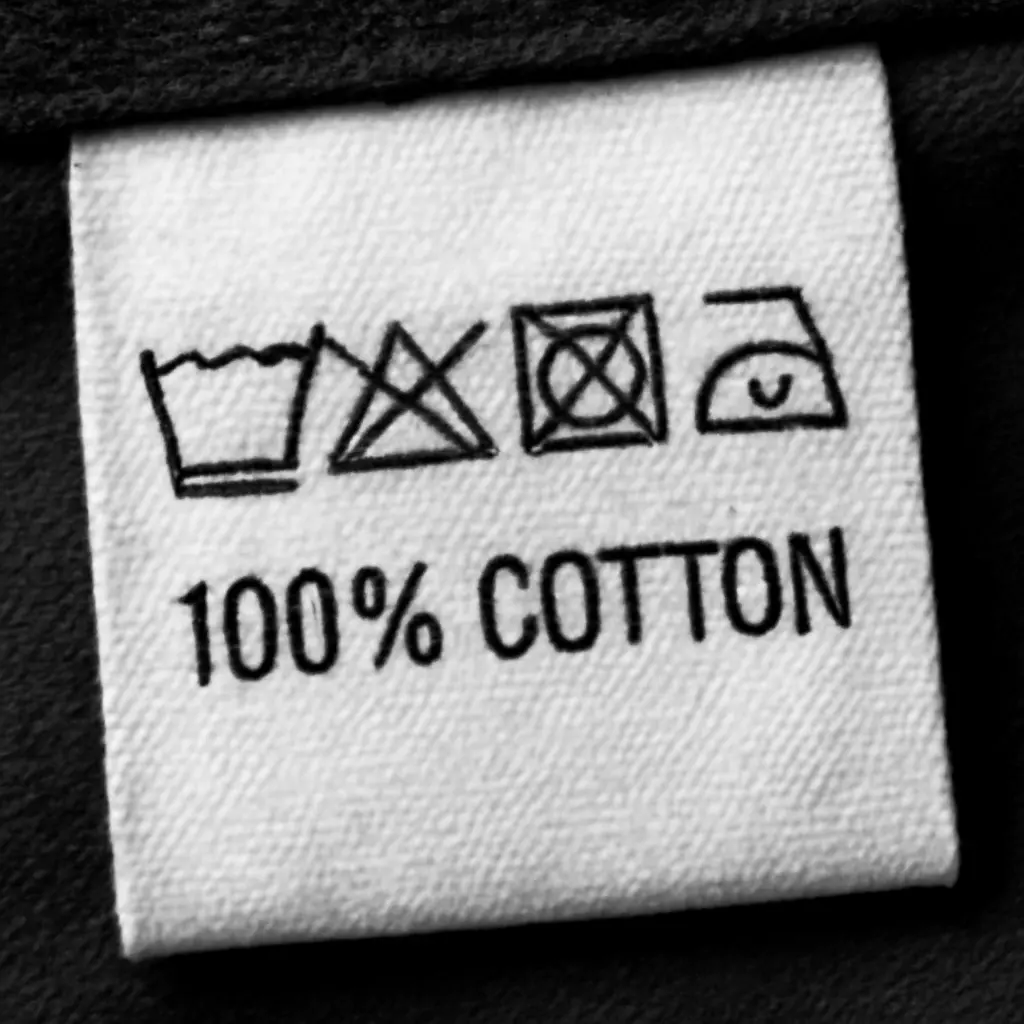 Clothing label with care symbols and composition details